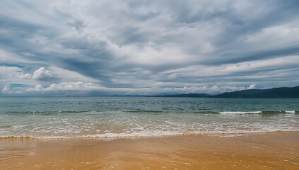 Fototapeta premium Overcast sky casting shadows over the sea, erosion risk