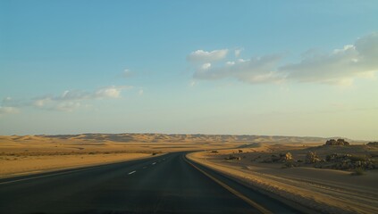 Desert landscape following a gentle rainfall along a highway in the Middle East