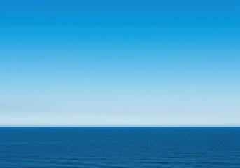 Obraz premium The vast open ocean meeting the clear blue sky along a perfectly straight, undisturbed natural horizon line at midday, surface, environment, water