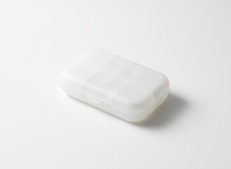 Compact white pill organizer case with blank logo area