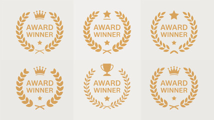Set of golden award winner emblems featuring laurel wreaths, crowns, stars, and trophies, representing achievement.