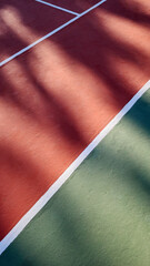 A detailed view of an empty tennis court and tennis ball.