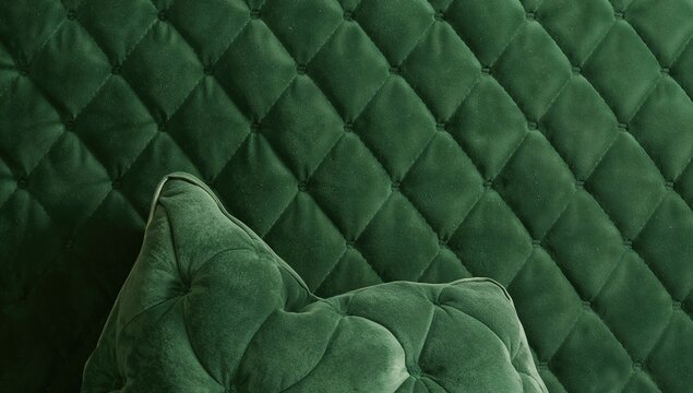 Quilted green velvet fabric backdrop, suitable for editorial header background