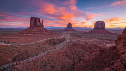 Stunning view of a valley featuring red rock formations and expansive desert landscape, ideal for travel and nature themes