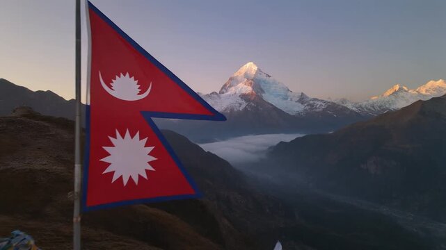 Nepal Flag Waving in Majestic Himalayas at Golden Hour Sunrise