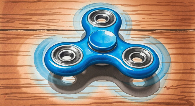 Fidget spinner spinning on wooden surface with a vibrant blue color  