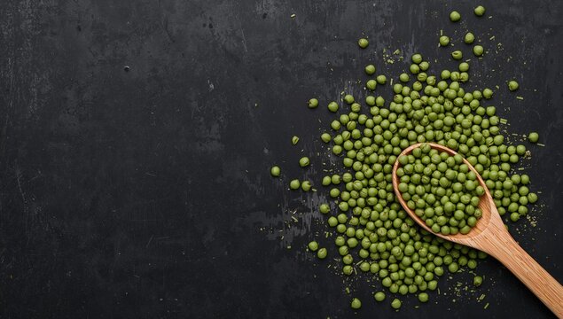 Scattered mung beans, nutrient-rich legumes in a wooden spoon, on a vintage black metallic backdrop - Powered by Adobe