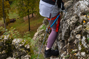Close-up. Via ferrata. An unidentified person climbs in the mountains  with the help of fixed safety ropes. Krakow-Czestochowa Upland, Poland