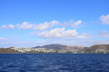 Naklejka premium View of the Gümüşlük neighborhood of the famous holiday resort Bodrum from the sea