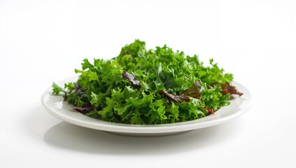 Fototapeta premium Salad featuring greens served on a white plate, a fiber-dense choice
