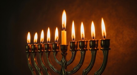 Fototapeta premium Burning hanukkah menorah with nine candles on dark brown background