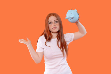 Woman with piggy bank shows concern over savings and finances at home