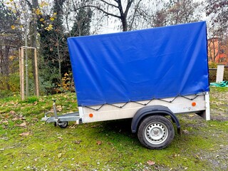 Small trailer with blue awning