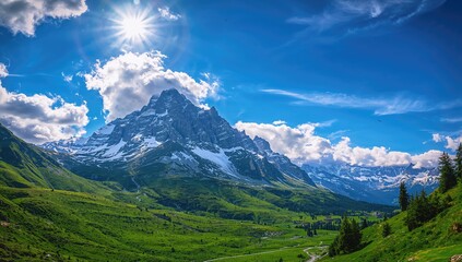 Alpine scenery showcasing a towering mountain peak beneath a blue and cloudy sky, seasonal change