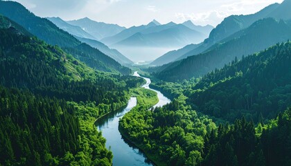 Serpentine River Winds Through Lush Green Mountain Valley Under Soft Blue Sky Hazy Distant Peaks Bathed in Sunlight