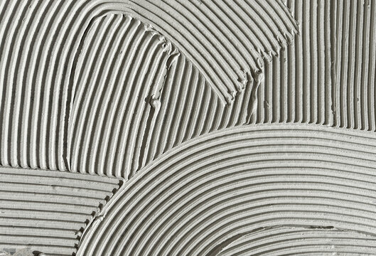Construction Adhesive Texture with Curved Grooves and Linear Ridges
