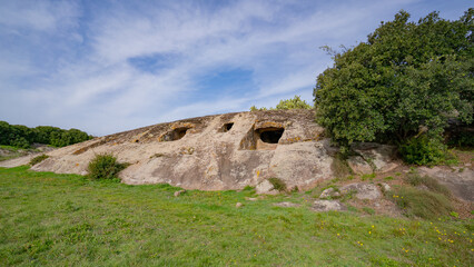 Prehistoric Domus de Janas of Genna Salixi Carved into Rocky Terrain