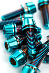 Lightweight and durable titanium bolts with hexagon head and washer on a bright white background