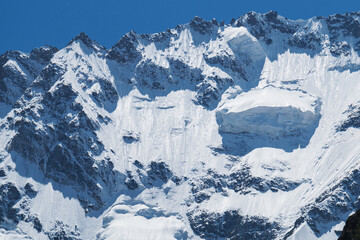 Snow-capped mountain peaks before avalanches