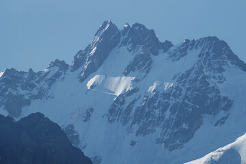 Snow-covered rocks in the clouds