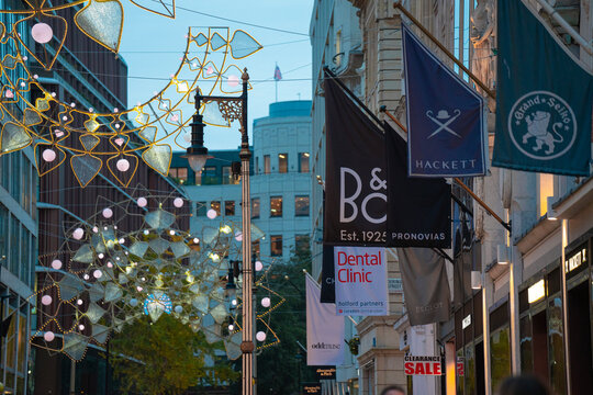 Hackett Shop Exterior Logo, Pronovias Shopfront Luxury Brand, Bang & Olufsen B&O Sign, Christmas Decorations, New Bond Street, Mayfair, Central London, UK &mdash; 13 November 2025
