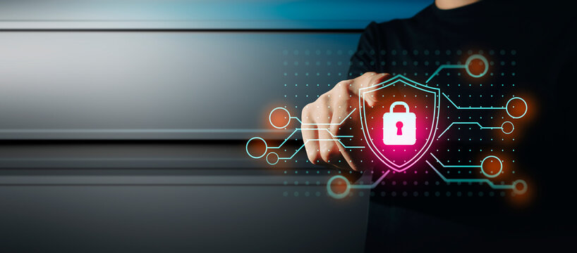 hand of businessman interactive touching a holographic anti-virus security shield system network and technology, success of trading innovation