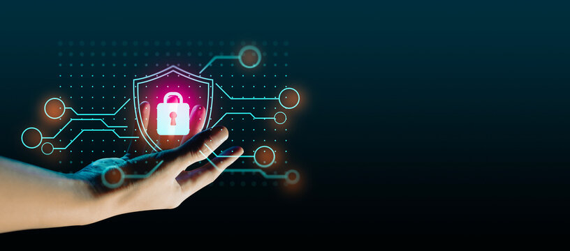 hand of businessman interactive touching a holographic anti-virus security shield system network and technology, success of trading innovation