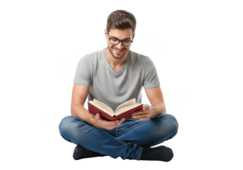 Young man with glasses wearing a grey t shirt and blue jeans sitting cross legged reading a book isolated on transparent background
