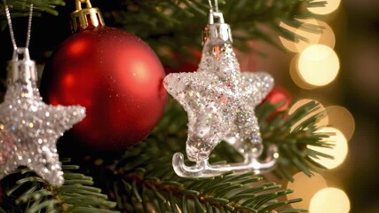Close-up of a glittering silver star and red bauble on a Christmas tree, warm bokeh lights and green fir needles creating a festive holiday mood. - Powered by Adobe