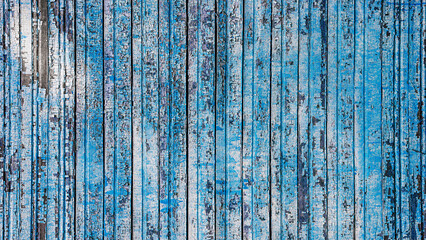 Vertical blue wooden planks with worn paint, subtle color gradients and scratches enhance rustic...