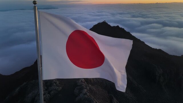 Japanese Flag Waving Over Majestic Sea of Clouds at Sunrise/Sunset