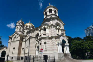 Fototapeta premium Riga Old Town view, Latvia, streets of Vecriga historical center with Town Hall square, House Of The Black Heads, Cathedral and church, travel to Latvia and Baltic States, summer day with a blue sky