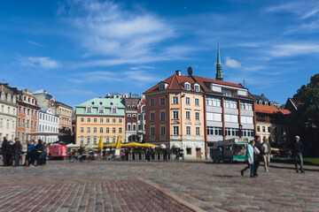 Fototapeta premium Riga Old Town view, Latvia, streets of Vecriga historical center with Town Hall square, House Of The Black Heads, Cathedral and church, travel to Latvia and Baltic States, summer day with a blue sky