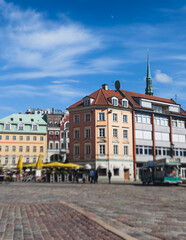 Fototapeta premium Riga Old Town view, Latvia, streets of Vecriga historical center with Town Hall square, House Of The Black Heads, Cathedral and church, travel to Latvia and Baltic States, summer day with a blue sky
