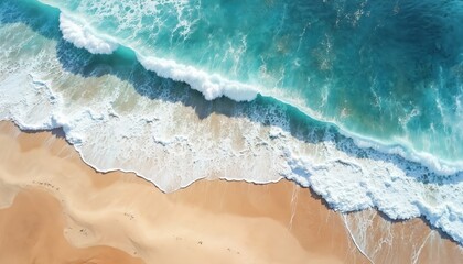 Turquoise waves crash onto sandy beach viewed from above. Ocean water is clear and vibrant, with white foam trailing incoming surf. Sunlight glints off sea surface, creating serene coastal scene.