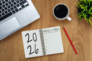 2026 Happy New Year Resolution Goal List and Plans Setting - Business office desk with notebook written about plan listing of new year goals and resolutions setting. Change and glee concept.