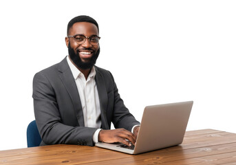 Smiling african american businessman in a suit working on a laptop computer at a wooden desk isolated on transparent background