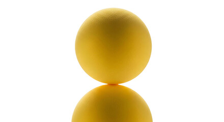 Yellow ball with reflection on a white surface