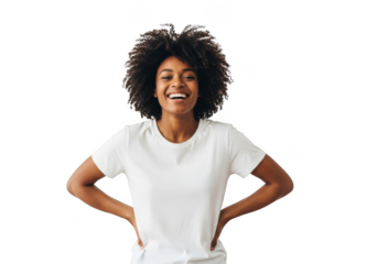 A joyful young black woman with a wide smile and curly hair wearing a plain white t shirt stands confidently with hands on her hips isolated on transparent background