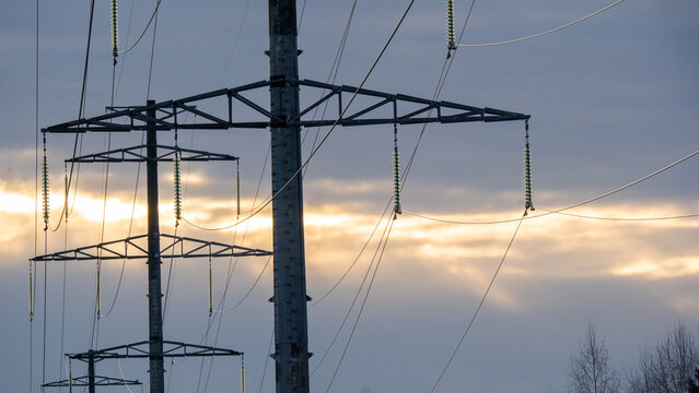 High-voltage power lines at dusk or dawn