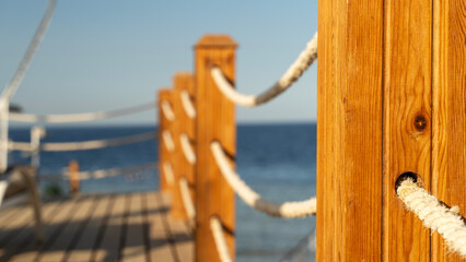 Rope fence on the beach at the pier