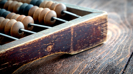 Vintage Accountant or Salesman Abacus on a Wooden Background