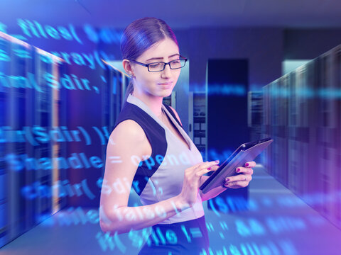 IT specialist analyzes software code using tablet in data center. Cybersecurity, programming, and digital technology management in modern computing systems.