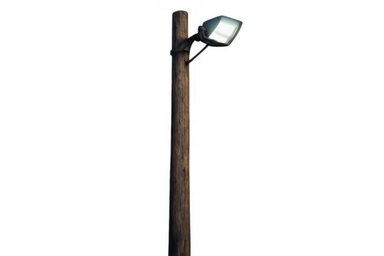 Wooden utility pole with modern led streetlight illuminating urban night scene on transparent background