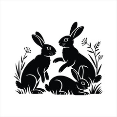 A charming black silhouette illustration featuring three rabbits in natural poses surrounded by grass, leaves, and wildflowers. The detailed artwork highlights the rabbits sitting, standing, and resti