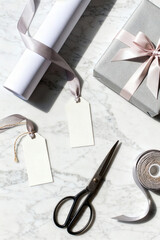Gift preparation with wrapping paper, scissors, and ribbon for a special occasion