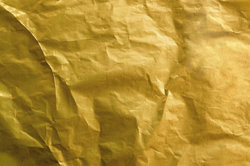 Golden Crumpled Gold Foil Texture. Background For Luxury Design And Packaging