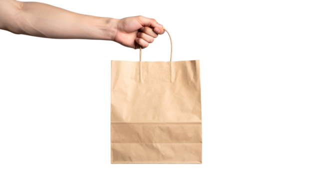 Hand holding a small, brown paper bag against a black background