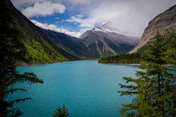 Turquoise alpine lake with snow-covered mountains in the Canadian Rockies