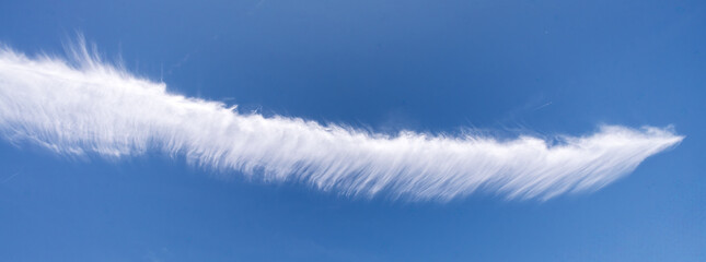 Serene sky scene with clouds, Delicate wispy clouds float across sky